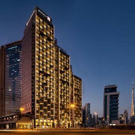 Millennium Atria Business Bay Aparthotel Дубай Екстериор снимка The hotel at night